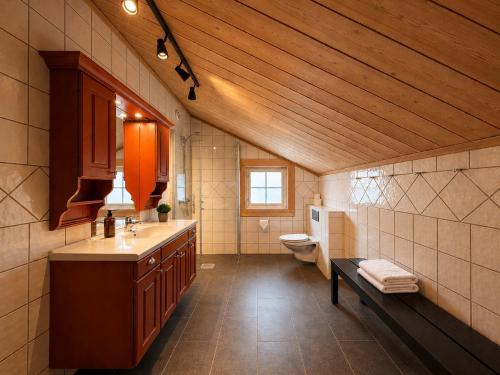 a bathroom with a sink and a toilet in it at Spacious cabin in Hemsedal, 8 bedrooms and sauna in Hemsedal
