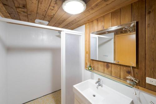 a bathroom with a sink and a mirror at Star Coffee & Homestay in Nanzhuang