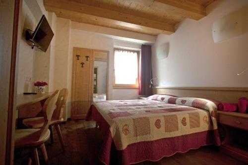 Postel nebo postele na pokoji v ubytování Agricampeggio Ai Gaggi
