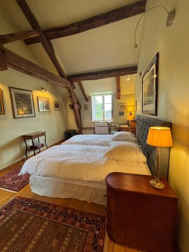 a bedroom with a large bed in a room at Villa Emma in Mavilly-Mandelot