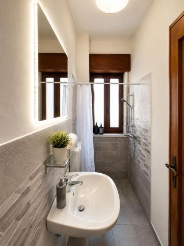 a bathroom with a sink and a shower at Harbor Elegance Estate in Milazzo