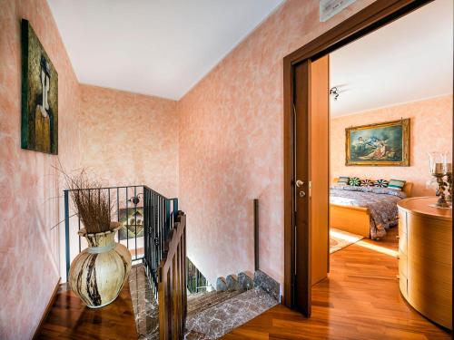 a hallway with a room with a bed and a vase at Villa Di Marmo in Trappitello