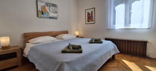 a bedroom with a bed with two towels on it at ISTRIEN-ADRIA in Rabac