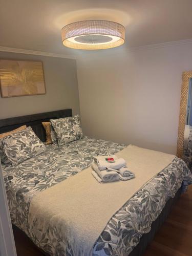 a bedroom with a bed with towels on it at Pátio de Alfama in Lisbon