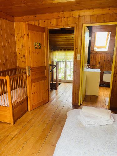 a large room with wooden walls and wooden floors at La Ruche - Tournesol in Mauriac