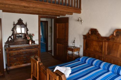 A bed or beds in a room at Ca Borgh