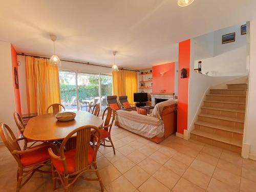 a living room with a table and chairs and a couch at Playa de Baria I in Vera