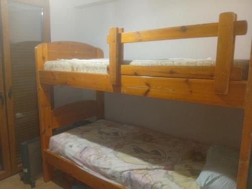 a couple of bunk beds in a room at Evriaki Rooms Lesvos in Apidias Lakos