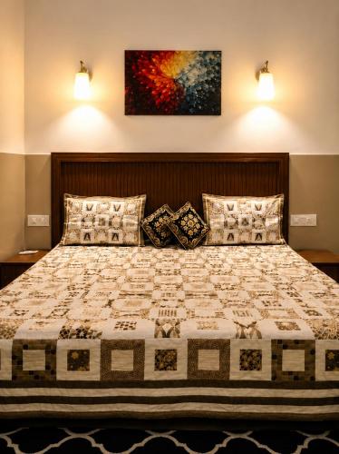 a bedroom with a large bed with two pillows at Nature View Retreat in Rishīkesh