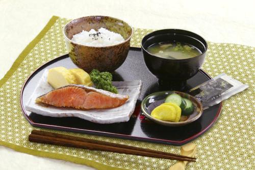 a plate of food with sushi and a bowl of soup at HOTEL K's L Adult only in Urigōchō
