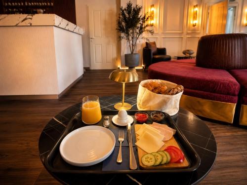 a tray of food on a table in a living room at Hotel Nare in Boppard