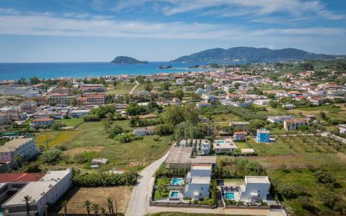an aerial view of a city with the ocean at SunWhite Villas - Private Pool & Cozy Atmosphere, by ZanteWize in Laganas