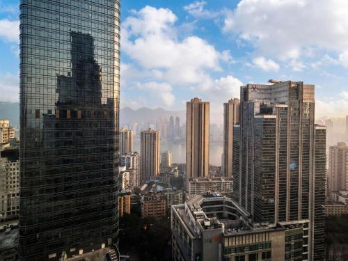 a view of a large city with skyscrapers at Mercure Chongqing Downtown in Chongqing