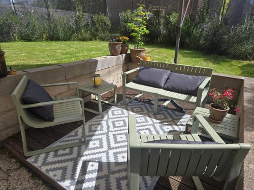 a patio with two chairs and a table at 22 in Érin