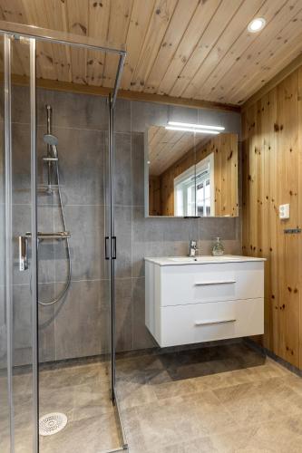 a bathroom with a shower and a sink at Unique mountain retreat in Gol in Gol