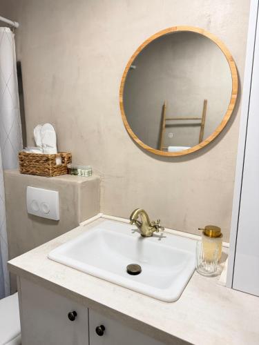 a bathroom with a sink and a mirror at Sailor's apartment in Supetar