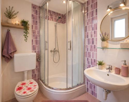 a bathroom with a shower and a toilet and a sink at Quiet Oasis in the Heart of Old Town- two kitchen,3bath in Split