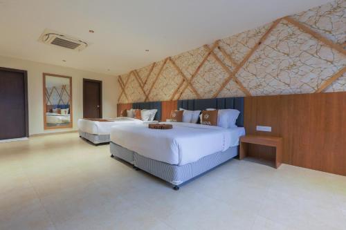 a large bedroom with two beds in a room at Hotel Nova Platinum Ujjain in Makoria Ām