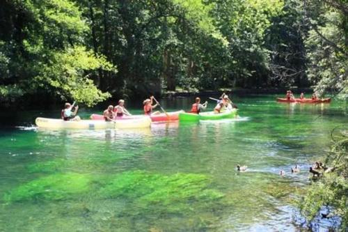 a group of people in canoes in a river at Camping 3 étoiles - Piscine - ccbfii0 in Châteauneuf-de-Gadagne