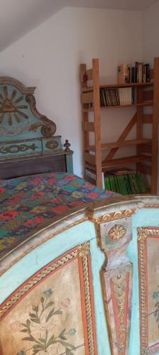 a bedroom with a bed with a wooden frame at Gemütliches Doppelzimmer mit Balkon in Furth im Wald