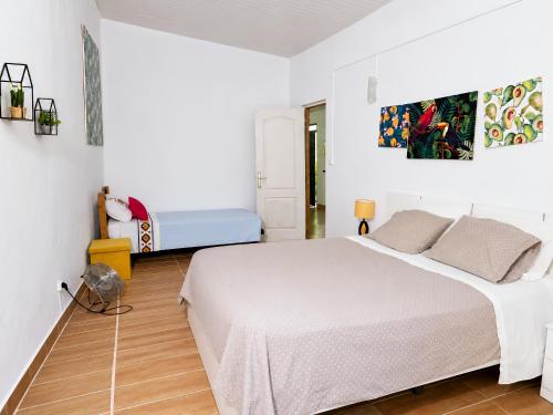 a bedroom with a large white bed in a room at Quinta da Ponte das Hortas 1 in Elvas