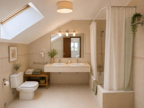 a bathroom with a toilet and a sink and a shower at Hotel Arresi in Arminza