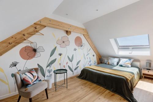 a bedroom with a bed with flowers on the wall at chambre d'hôtes des bleuets in Saint-Firmin-des-Prés