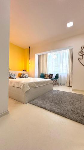 Un pat sau paturi într-o cameră la Angel Studio Central