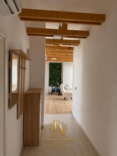 a hallway of a house with wooden ceilings at Luxury Apartments in Brčko