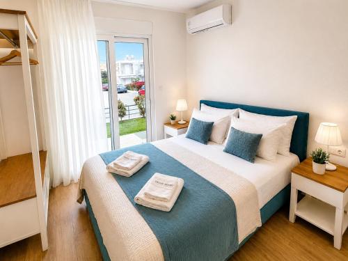 a bedroom with a large bed and a window at Pool Access Danai 15,1 in Ofrínion
