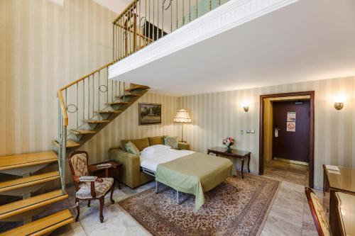 a hotel room with a bed and a staircase at Hotel Moskva in Belgrade