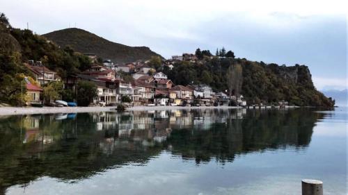 a town on the shore of a body of water at Rooms and Apartaments De Niro in Trpejca
