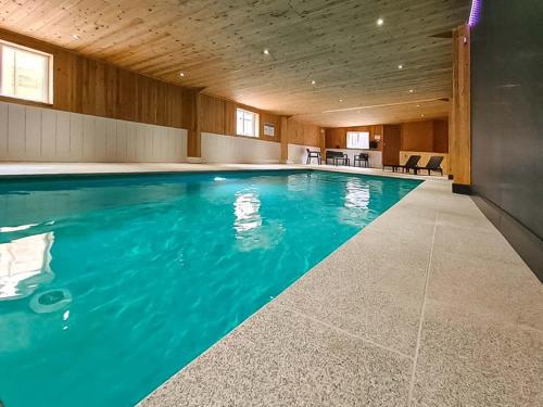 a swimming pool with blue water in a building at Birch Cottage - Ukc9267 in Hope
