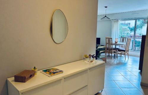 a living room with a mirror on the wall at Appt Lakeside - Hossegor centre - Terrasse in Hossegor
