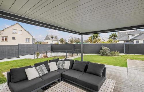 a black couch sitting on a patio at Villa Botero Dinard in Dinard