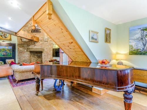 a house with a piano in a living room at Seaton Court - Uk31955 in Staithes