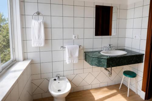 a bathroom with a sink and a toilet at Hotel Andalucia in Lanjarón