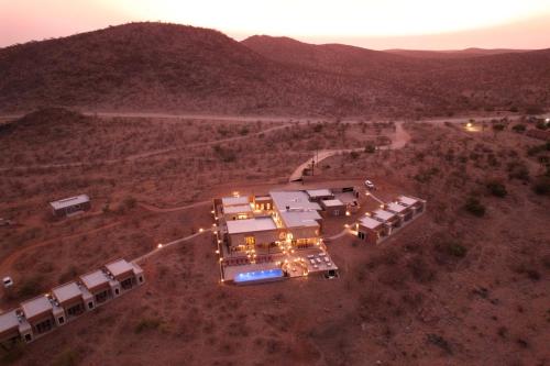 an aerial view of a house in the desert at Lodge Damaraland in Khorixas