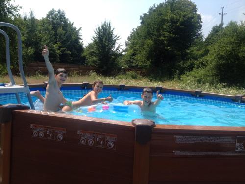 a group of people in a hot tub at Guest House Pid Dubom Карпати Під Дубом in Skole