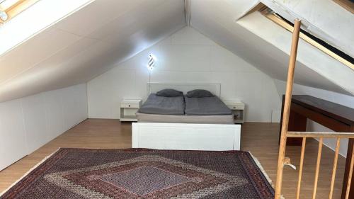 a bedroom with a bed in a attic at Sia Home in Vålberg