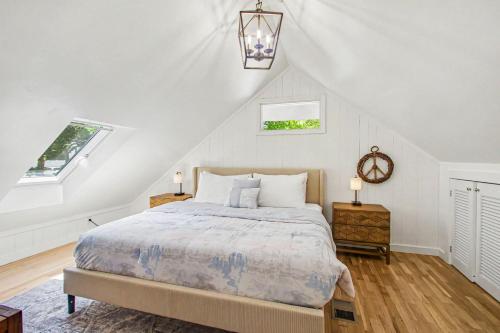 a bedroom with a bed and two windows at Union Retreat in Douglas
