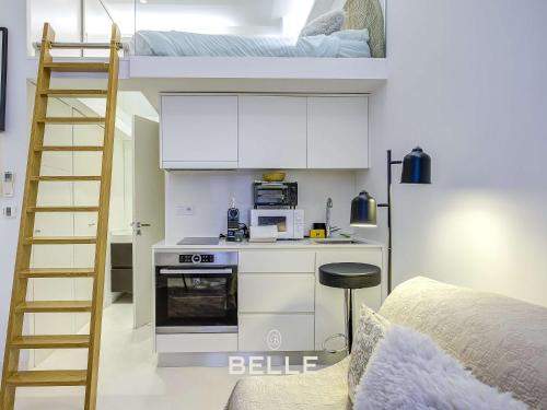 a room with a bunk bed and a kitchen with a ladder at Rocher - 3min Port Hercule - Casino in Monte Carlo
