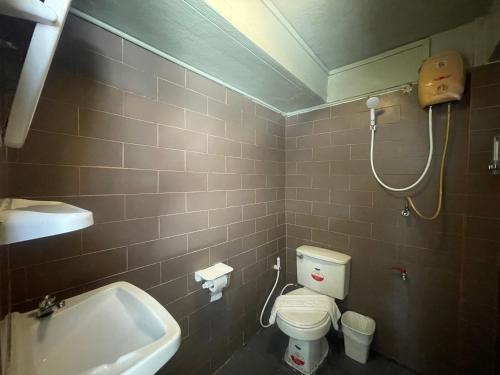 a bathroom with a sink and a toilet and a shower at ON'S Place in Pattaya
