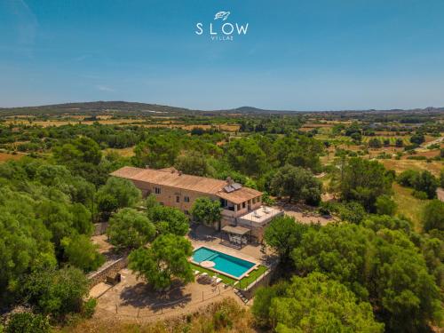 an aerial view of a villa with a swimming pool at Villa Bandris by Slow Villas in Manacor