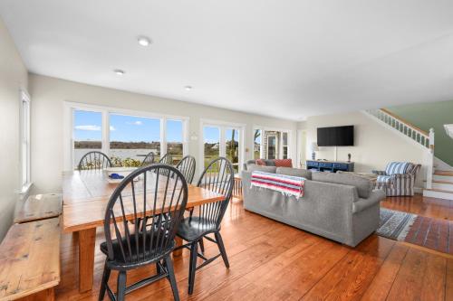 a living room with a table and chairs and a couch at Kelley Lane - CHT- KL161 in Chatham