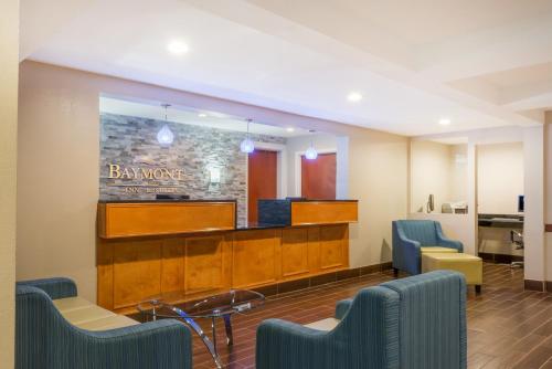 a waiting room with chairs and a reception desk at Baymont by Wyndham Georgetown Lexington North in Georgetown
