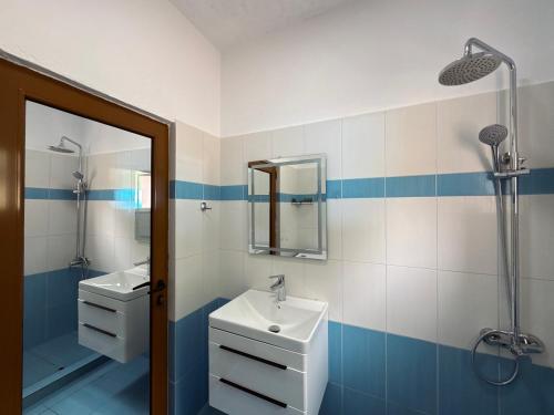 a bathroom with a sink and a shower at Villa Kalo in Blerimas