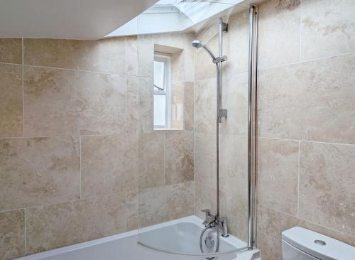 a bathroom with a shower and a toilet at Compass Cottage , Emsworth in Emsworth