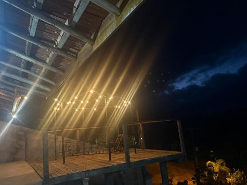 a building with lights on it at night at Rancho do Ipês in Campos do Jordão
