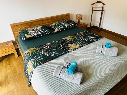 a bedroom with a bed with towels on it at Casa Marysol in Ventimiglia